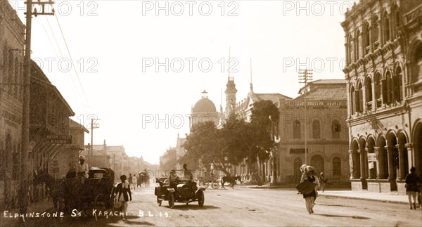 Elphinstone Street in Karachi. View down Elphinstone Street in Karachi. One of Karachi's oldest streets, it was named in honour of a British colonist and is lined with colonial-style buildings. It was renamed Zaibunnisa Street in 1970 by the Karachi Government in honour of Pakastani journalist, Zaib-un-Nissa Hamidullah. Karachi, India (Pakistan), circa 1910. Karachi, Sindh, Pakistan, Southern Asia, Asia.