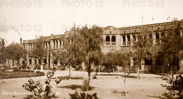 Civil hospital in Karachi. Exterior view of the civil hospital in Karachi. The long, arcaded, two-storey building was built in 1898 in colonial-style. Karachi, India (Pakistan), circa 1910. Karachi, Sindh, Pakistan, Southern Asia, Asia.