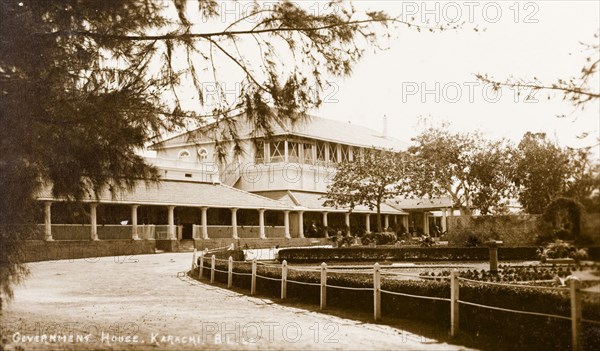 Government House in Karachi. View across a formal garden of Karachi's Government House, a large colonial-style building with a colonnaded veranda. Karachi, India (Pakistan), circa 1910. Karachi, Sindh, Pakistan, Southern Asia, Asia.