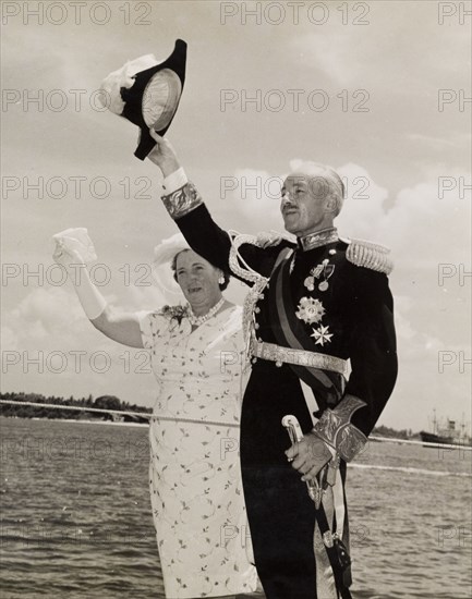 Sir Richard Turnbull waves farewell to Tanganyika. Sir Richard Turnbull (1909-1998), the last British colonial Governor of Tanganyika, and his wife, Lady Beatrice, wave farewell to the newly independent Tanzania before departing on HMS Loch Ruthven. Tanganyika (Tanzania), 8 December 1962. Tanzania, Eastern Africa, Africa.