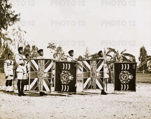 The Tanganyika Rifles present their colours. Soldiers of the Tanganyika Rifles present their colours during a visit by Sir Richard Turnbull (1909-1998), the last British colonial Governor of Tanganyika. Tanganyika (Tanzania), 1962. Tanzania, Eastern Africa, Africa.