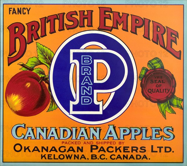 Advertisement for British Empire apples. A fruit box label advertises 'British Empire P Brand' Canadian apples from British Colombia, packed and shipped by Okanagan Packers Ltd., and distributed throughout North America and the United Kingdom. British Colombia, Canada, circa 1930., British Columbia, Canada, North America, North America .