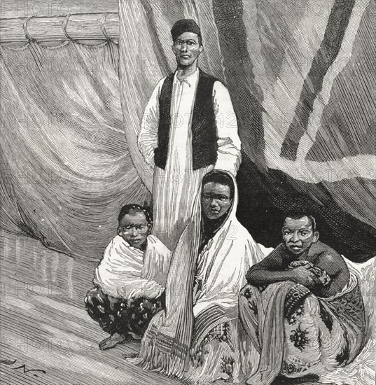 African slaves liberated by the British Royal Navy. An illustration taken from the front page of 'The Graphic' newspaper depicts three African slaves and an interpreter on the deck of HMS Garnet, shortly after their emancipation from an illegal slave dhow by the British Royal Navy. Indian Ocean, 20 October 1888., Indian Ocean, Africa.