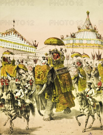 Ceremonial march for the Empress of India. An illustration from a pamphlet of piano sheet music depicts a ceremonial march, held to honour Queen Victoria's assumption of the title Empress of India. British dignitaries ride decorated elephants, accompanied by a military escort. India, January 1877. India, Southern Asia, Asia.