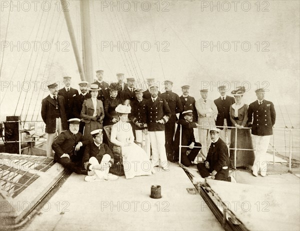 Royal party enroute to Australia. The Duke and Duchess of Cornwall and York (later King George V and Queen Mary) are pictured (centre) aboard HMS Ophir enroute to Australia to open the first Commonwealth Parliament in Melbourne. Amongst the royal entourage is Prince Alexander of Teck (1874-1957), the Duchess of York's younger brother. Probably Indian Ocean, March 1901., Australia, Oceania.