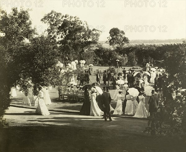 New Year's garden party at Government House, Perth. Formally dressed guests socialise in the grounds of Government House at a New Year's garden party organised by the Earl of Hopetoun, Governor General of Australia. Perth, Australia, January 1902. Perth, West Australia, Australia, Australia, Oceania.