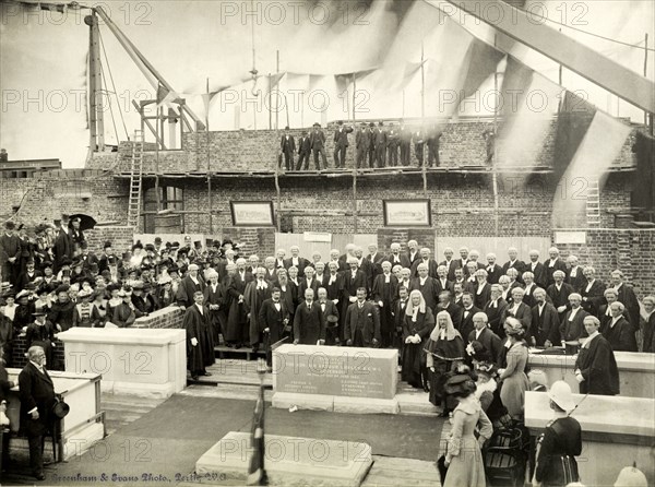 Laying of the Supreme Court foundation stone, Perth. Sir Arthur Lawley (1860-1932), Governor of Western Australia, lays the foundation stone of the Supreme Court in Stirling Gardens. He stands with his hand on the inscribed block, accompanied by an array of judges and lawyers in legal dress. Perth, Australia, 2 June 1902. Perth, West Australia, Australia, Australia, Oceania.