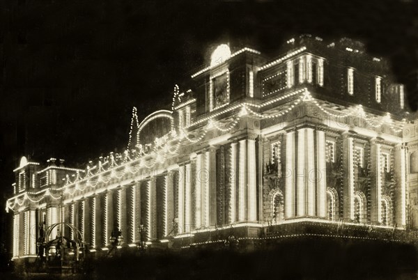 Illuminations for the royal visit, Melbourne. The Treasury Building, located on Spring Street, is illuminated with lights to welcome the Duke and Duchess of Cornwall and York (later King George V and Queen Mary) who had travelled from England to open the first Commonwealth Parliament of Australia. Melbourne, Australia, May 1901. Melbourne, Victoria, Australia, Australia, Oceania.