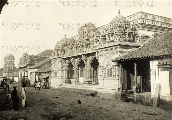 A Hindu temple in Colombo. A Hindu temple with an ornate, carved stone facade flanks a dirt road in Colombo. Colombo, Ceylon (Sri Lanka), circa 1901. Colombo, West (Sri Lanka), Sri Lanka, Southern Asia, Asia.