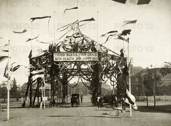 Decorative marquee for the royal visit, Perth. A marquee festooned with garlands and flags at the intersection of Milligan Street and St. George's Terrace, part of celebrations to welcome the Duke and Duchess of Cornwall and York (later King George V and Queen Mary) to Perth. Perth, Australia, July 1901. Perth, West Australia, Australia, Australia, Oceania.