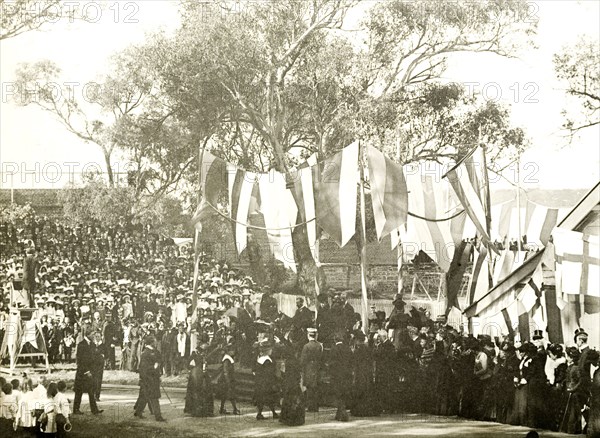 The Duke and Duchess address school children, Perth. Crowds of spectators watch as the Duke and Duchess of Cornwall and York (later King George V and Queen Mary) address school children in the grounds of Government House. Perth, Australia, 25 July 1901. Perth, West Australia, Australia, Australia, Oceania.