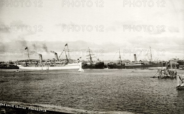 HMS Ophir leaves the port of Fremantle. HMS Ophir leaves Perth via the port of Fremantle, carrying the Duke and Duchess of Cornwall and York (later King George V and Queen Mary) on their royal tour of Australia. Fremantle, Australia, 1901. Fremantle, West Australia, Australia, Australia, Oceania.