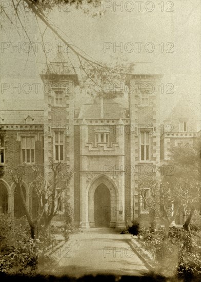 Front entrance of Government House, Perth. A wide path, flanked by trees, leads up to an arched doorway at the front entrance to Perth's Government House. Perth, Australia, circa 1901. Perth, West Australia, Australia, Australia, Oceania.