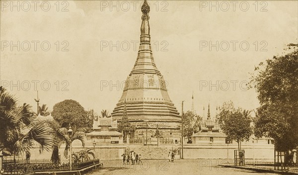 The Sule Pagoda in Rangoon. A line of trees flanks a promenade leading up to the Sule Pagoda. Rangoon (Yangon), Burma (Myanmar), circa 1920. Yangon, Yangon, Burma (Myanmar), South East Asia, Asia.