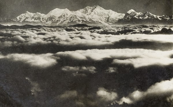 Kanchenjunga shrouded by clouds. View of the Himalayan mountain Kanchenjunga, taken from Tiger Hill. Darjeeling, India, circa 1922. Darjeeling, West Bengal, India, Southern Asia, Asia.