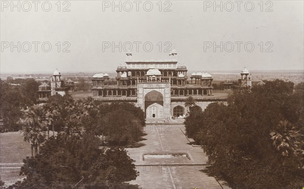 Emperor Akbar's tomb at Sikandra. View of Mughal Emperor Akbar's tomb (r.1556-1605) and the formal gardens that surround it. A decorative 'pishtaq' projects from the facade of the building, leading to the five-tiered tomb, which features pillared arcades with domed 'chattris', and culminates in an open terraced roof. Sikandra, United Provinces (Uttar Pradesh), India, circa 1923. Sikandra, Uttar Pradesh, India, Southern Asia, Asia.