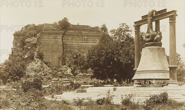 The bronze bell at Mingun Pagoda. The ruins of Mingun Pagoda and its huge bronze bell. The bell was cast by order of King Bodawpaya between 1809 and 1811, and is the largest ringing bell in the world. Burma (Myanmar), circa 1926. Mingun, Sagaing, Burma (Myanmar), South East Asia, Asia.