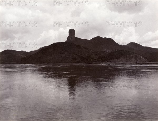 Monk's Head Rock' across the Xijiang River. View across the Xijiang River, featuring an unusual rock formation identified as 'Monk's Head Rock'. Near Hong Kong, China, circa 1903., Hong Kong, China, People's Republic of, Eastern Asia, Asia.