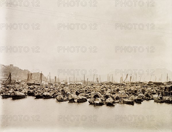 Sampans in Shau Kei Wan bay. Hundreds of Chinese sampans sit at anchor in Shau Kei Wan bay. Shau Kei Wan, Hong Kong, China, circa 1903. Shau Kei Wan, Hong Kong, China, People's Republic of, Eastern Asia, Asia.