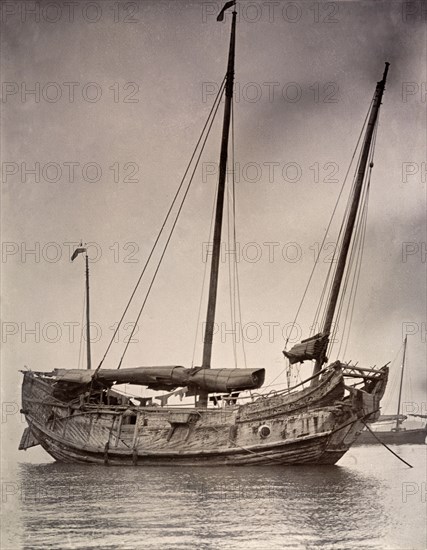 A Chinese junk at anchor. A Chinese junk, pictured at anchor with its sails rolled down. Hong Kong, China, circa 1903., Hong Kong, China, People's Republic of, Eastern Asia, Asia.