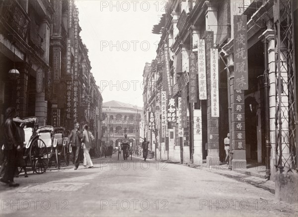 Queen's Road west, Hong Kong. Rickshaw drivers wait for passing business on Queen's Road west. Hong Kong, China, circa 1903. Hong Kong, Hong Kong, China, People's Republic of, Eastern Asia, Asia.