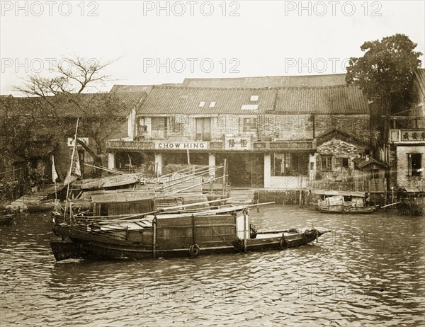 Riverside scene in Canton. Three sampans are moored at a riverside harbour. Canton, Canton Province (Guangzhou, Guangdong), China, circa 1905. Guangzhou, Guangdong, China, People's Republic of, Eastern Asia, Asia.