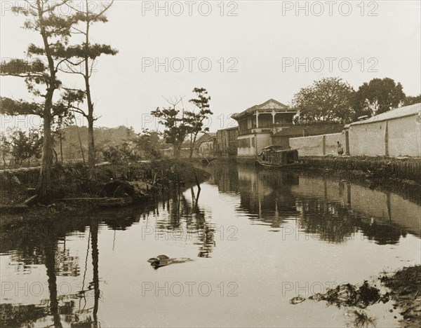 Canal near Canton. View along a canal near Canton (Guangzhou). Canton Province (Guangdong), China, circa 1905., Guangdong, China, People's Republic of, Eastern Asia, Asia.