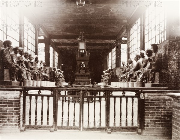 The Temple of 500 Genii, Canton. Interior view of the Buddhist Temple of 500 Genii. The statues of genii that line the walls represent the 500 disciples of Buddha who supposedly founded the temple in around 500AD. Canton, Canton Province (Guangzhou, Guangdong), China, circa 1905. Guangzhou, Guangdong, China, People's Republic of, Eastern Asia, Asia.