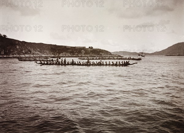 Chinese Dragon Boat Festival on the Li River. Teams of rowers race each other on the Li River during festivites for the annual Chinese Dragon Boat Festival. Aberdeen, Hong Kong, China, circa 1905. Aberdeen, Hong Kong, China, People's Republic of, Eastern Asia, Asia.