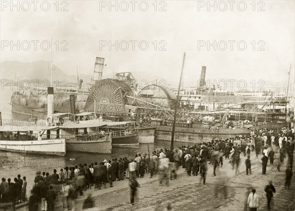 SS Hankow gutted by fire after a typhoon. SS Hankow, a Hong Kong paddle steamer, pictured in harbour shortly after a fire gutted her interior, claiming 100 lives. Related photographs suggest the boat may have been one of many vessels affected by a devastating typhoon that struck Hong Kong on 18 September. Hong Kong, China, circa 14 October 1906., Hong Kong, China, People's Republic of, Eastern Asia, Asia.
