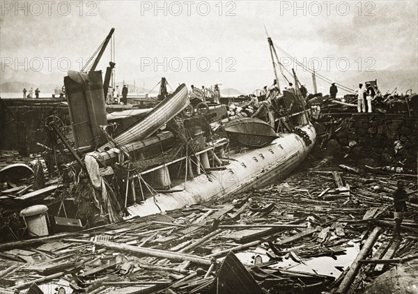 Wreckage of a French destroyer after a typhoon. The wreckage of a French naval destroyer lies in a tangled heap on the harbourside, three weeks after it was stricken by a devastating typhoon that killed an estimated 10,000 people. Hong Kong, China, circa 14 October 1906., Hong Kong, China, People's Republic of, Eastern Asia, Asia.
