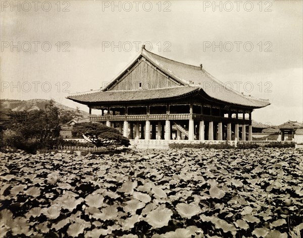 The Gyeonghoeru Pavilion at Gyeongbok Palace. The Gyeonghoeru Pavilion at Gyeongbok Palace, situated on an island at the centre of a lotus pond. The building features a curved roof, which rests on 48 granite pillars. Seoul, Korea (South Korea), circa 1920. Seoul, Special City, South Korea, Eastern Asia, Asia.