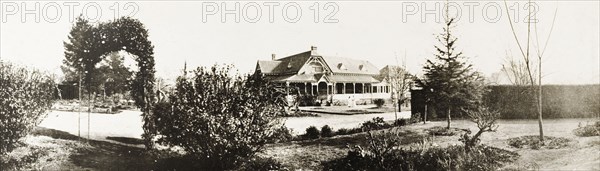 Government House, Pretoria. Exterior view across the formal gardens to the colonial-style Government House in Pretoria. Pretoria, South Africa, circa 1903. Pretoria, Gauteng, South Africa, Southern Africa, Africa.