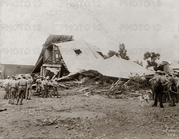 Shop destroyed by floods in Bloemfontein. A shop is reduced to rubble by heavy flooding resulting from a burst dam caused by freak rainfall. 176 buildings and shops were destroyed by the floods, and approximately 25 people lost their lives. Bloemfontein, South Africa, 17 January 1904. Bloemfontein, Free State, South Africa, Southern Africa, Africa.
