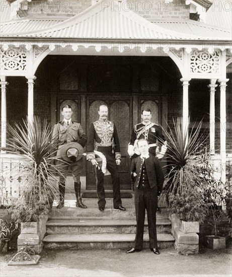 Sir Arthur Lawley before Legislative Council. Sir Arthur Lawley (1860-1932), Lieutenant Governor of the Transvaal, poses for a group portrait outside Government House with his aides-de-camps, Captain King and Major Geoffrey Glyn, and his son, Richard Edward Lawley (1887-1909), shortly before a meeting of the Legislative Council of the Transvaal. Pretoria, South Africa, 1904. Pretoria, Gauteng, South Africa, Southern Africa, Africa.