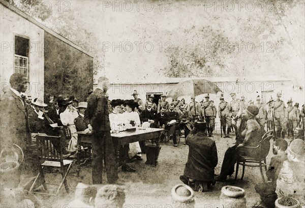 British officials meet the Queen Regent of Swaziland. Sir Arthur Lawley (1860-1932), Lieutenant Governor of the Transvaal, Lady Annie Lawley, Reverend Algernon Lawley and Major Geoffrey Glyn, attend an 'indaba' (council) with Labotsibeni Gwamile Mdluli, the Queen Regent of Swaziland. Near Mbabane, Swaziland, 24 August 1904. Mbabane, Hhohho, Swaziland, Southern Africa, Africa.