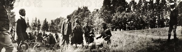 Sobhuza II, King of Swaziland, with toys. Five year old Sobhuza II, the King of Swaziland, inspects a toy elephant and trumpet given to him by Lady Annie Lawley at an 'indaba' (council) held between his grandmother, Queen Regent Labotsibeni, and British officials. Near Mbabane, Swaziland, 24 August 1904. Mbabane, Hhohho, Swaziland, Southern Africa, Africa.