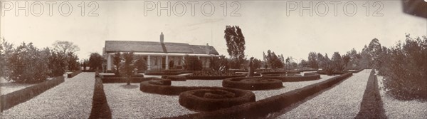 Parterre at Bulawayo Government House. View across a parterre planted with sculpted box hedges, looking towards Bulawayo's Government House. Bulawayo, Rhodesia (Zimbabwe), circa July 1904. Bulawayo, Zimbabwe, Southern Africa, Africa.
