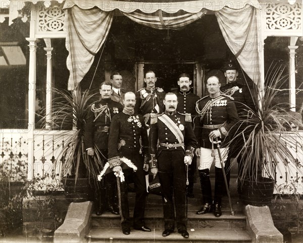 Group portrait of Sir Arthur Lawley and Lord Selborne. British officials, including Lord Selbourne, the newly-appointed High Commissioner for South Africa, and Sir Arthur Lawley, Lieutenant Governor of the Transvaal, pose for a group portrait outside Government House, shortly before the meeting of the July 1905 Legislative Council. Pretoria, South Africa, July 1905. Pretoria, Gauteng, South Africa, Southern Africa, Africa.