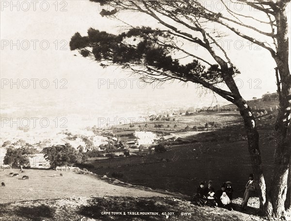 Family portrait on Signal Hill. A family group pose for a portrait on Signal Hill, with a view across Cape Town looking towards Table Mountain in the distance. Cape Town, South Africa, circa 1895. Cape Town, West Cape, South Africa, Southern Africa, Africa.