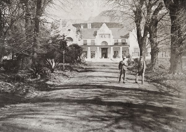 Cecil Rhodes' house at Groote Schuur. Captain Arthur Lawley (1860-1932) and Earl Grey (1851-1917) pose on the driveway of Cecil Rhodes' house at Groote Schuur, an estate in Cape Town that was remodelled in 1893 by architect Herbert Baker. Cape Town, South Africa, 1897. Cape Town, West Cape, South Africa, Southern Africa, Africa.