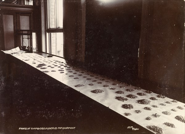 De Beers diamonds. Diamonds are sorted into parcels, ready for shipment, at the De Beers offices in Kimberley. Kimberley, South Africa, circa 1896. Kimberley, North Cape, South Africa, Southern Africa, Africa.