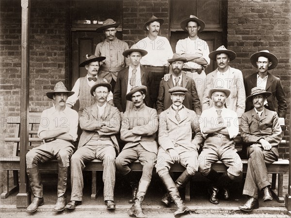 Native Commissioners of Matabeleland. Captain Arthur Lawley (1860-1932), Administrator of Matabeleland, poses for a group portrait with several Native Commissioners. Bulawayo, Rhodesia (Zimbabwe), circa 1898. Bulawayo, Matabeleland North, Zimbabwe, Southern Africa, Africa.