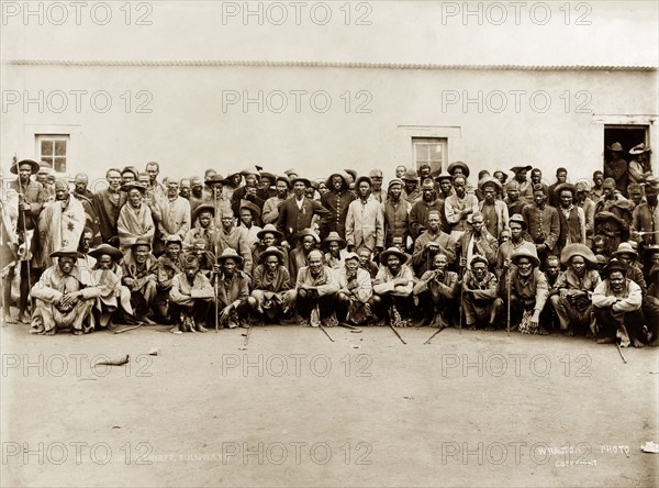 Matabele indunas. A number of Matabele (Ndebele) indunas (chiefs) pose for a group portrait outdoors after an indaba (council) with British officials following the Matabele rebellion of 1896. Bulawayo, Rhodesia (Zimbabwe), 1897. Bulawayo, Matabeleland North, Zimbabwe, Southern Africa, Africa.