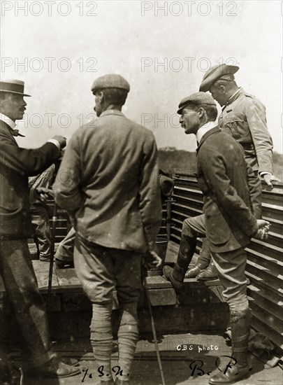 Robert Baden-Powell travelling in armoured train. Captain J.S. Nicholson (left) and Robert Baden-Powell (1857-1941) chat with companions as they travel through Mafeking in an armoured train. Mafeking (Mafikeng), South Africa, 1 June 1900. Mafikeng, North West (South Africa), South Africa, Southern Africa, Africa.