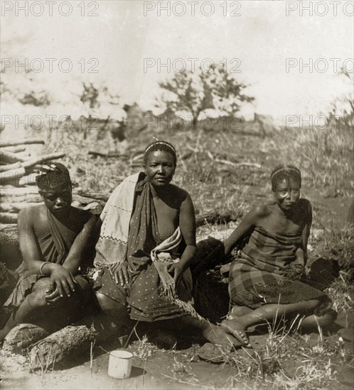 Three of Lobengula's widows. Three widows of Lobengula Kumalo (d.1894), King of the Matabele, attend an indaba (council) at Cecil Rhodes' farm in Sauerdale. They are identified as (left to right): Sitshwapa, Myoiyana and Mfungu. Near Bulawayo, Rhodesia (Matabeleland North, Zimbabwe), 5 July 1897., Matabeleland North, Zimbabwe, Southern Africa, Africa.