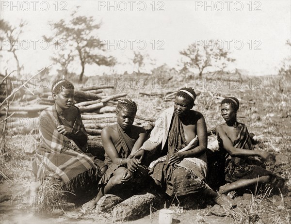 Four of Lobengula's widows. Four widows of Lobengula Kumalo (d.1894), King of the Matabele, attend an indaba (council) at Cecil Rhodes' farm in Sauerdale. They are identified as (left to right): Lomalonuve, Sitshwapa, Myoiyana and Mfungu. Near Bulawayo, Rhodesia (Matabeleland North, Zimbabwe), 5 July 1897., Matabeleland North, Zimbabwe, Southern Africa, Africa.