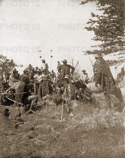 A Matabele indaba at Cecil Rhodes' farm. Matabele (Ndebele) indunas (chiefs) attend an indaba (council) hosted by Cecil Rhodes at Sauerdale farm. Rhodes bought the farm after negotiating an end to the Matabele rebellion. Near Bulawayo, Rhodesia (Zimbabwe), 5 July 1897., Matabeleland North, Zimbabwe, Southern Africa, Africa.