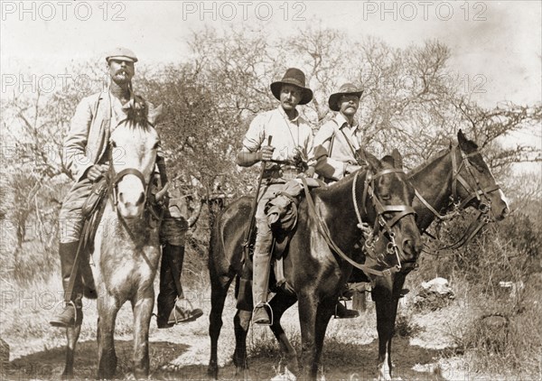 Nicholson and the Lawley brothers. Captain J.S. Nicholson, Major Richard Lawley (1856-1918) and Captain Arthur Lawley (1860-1932), Administrator of Matabeleland, pose for the camera on horseback during a hunting expedition. Inyati, Matabeleland, Rhodesia (Matabeleland North, Zimbabwe), circa August 1897. Inyati, Matabeleland North, Zimbabwe, Southern Africa, Africa.