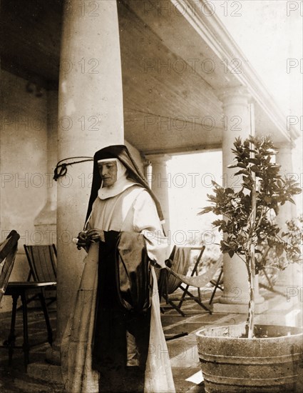 Reverend Mother Jacoba. Reverend Mother Jacoba of the Bulawayo Memorial Hospital, pictured on the colonaded veranda outside Government House. Bulawayo, Rhodesia (Zimbabwe), circa 1897. Bulawayo, Matabeleland North, Zimbabwe, Southern Africa, Africa.